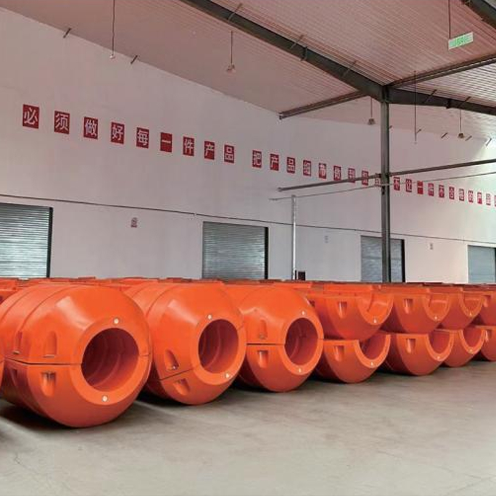 Orange pipe floats arranged in a workshop