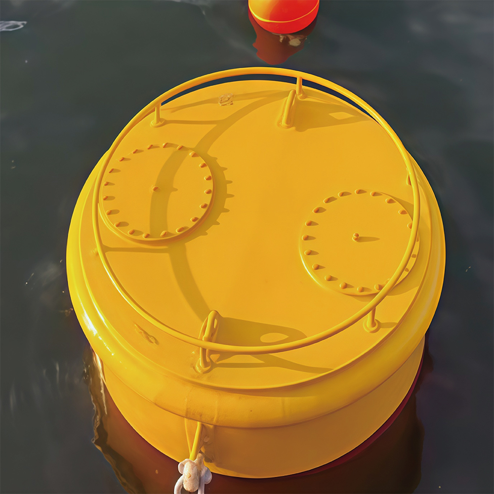Top view of a yellow mooring buoy afloat