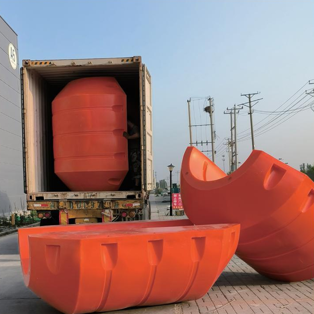 Split pipe float shells beside a shipping container